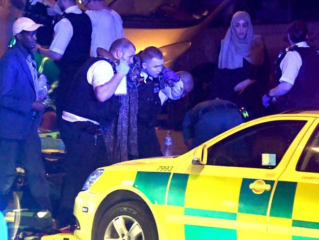 A man can barely walk as he is helped after the van ploughed into pedestrians near Finsbury Park Mosque. Picture: REX/Shutterstock