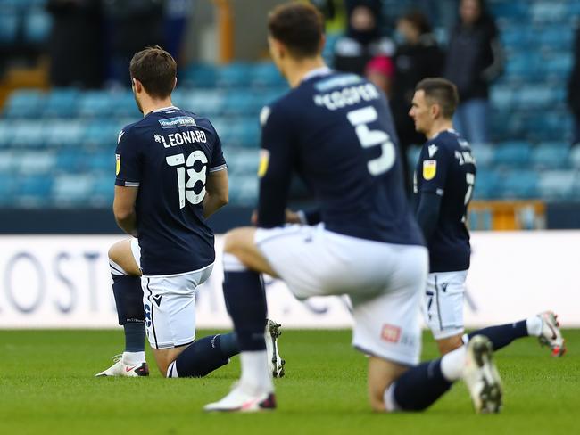 LONDON, ENGLAND - DECEMBER 05: Ryan Leonard of Millwall kneeling for black lives matter during the Sky Bet Championship match between Millwall and Derby County at The Den on December 05, 2020 in London, England. A limited number of fans are welcomed back to stadiums to watch elite football across England. This was following easing of restrictions on spectators in tiers one and two areas only. (Photo by Jacques Feeney/Getty Images)