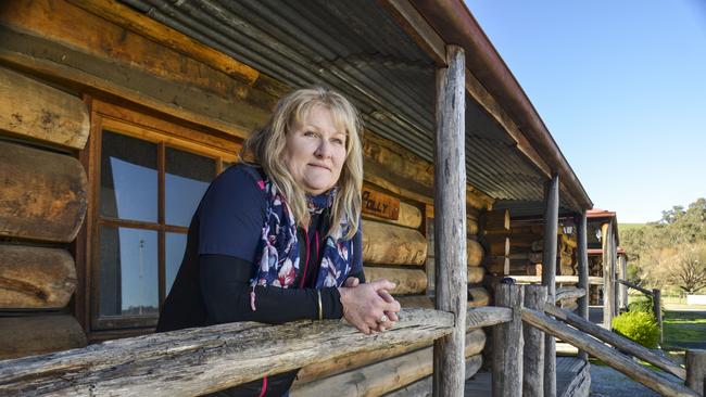 Dargo Hotel publican Helen Hall outside the Hotel's log cabins. Picture: Dannika Bonser