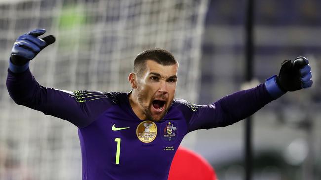 Socceroos goalkeeper Mat Ryan celebrates after saving the penalty shot of Uzbekistan’s Marat Bikmaev. Picture: Getty Images