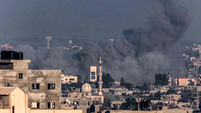 Smoke billows over Khan Yunis during Israeli bombardment from Rafah in the southern Gaza Strip on December 25, amid the ongoing conflict. Picture: Said Khatib/AFP