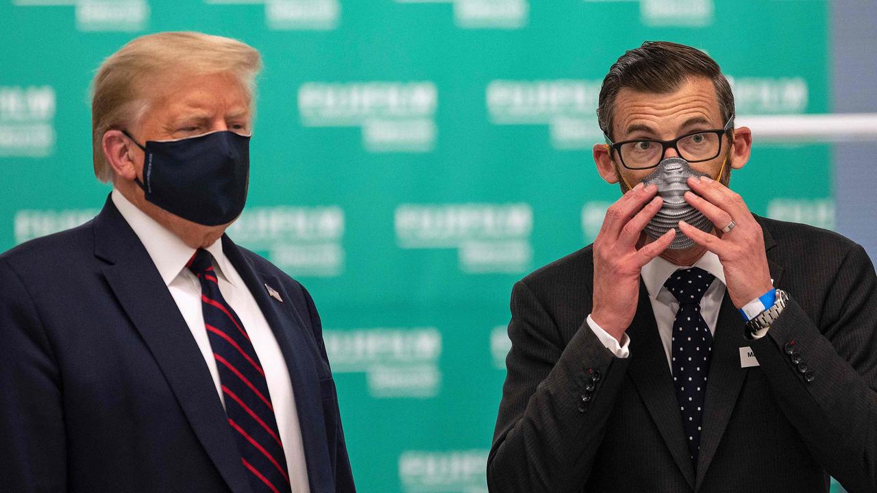 US President Donald Trump (left) with Fujifilm Diosynth Biotechnologies CEO Martin Messon at a lab where components are being made for a potential vaccine. Picture: Jim Watson/AFP