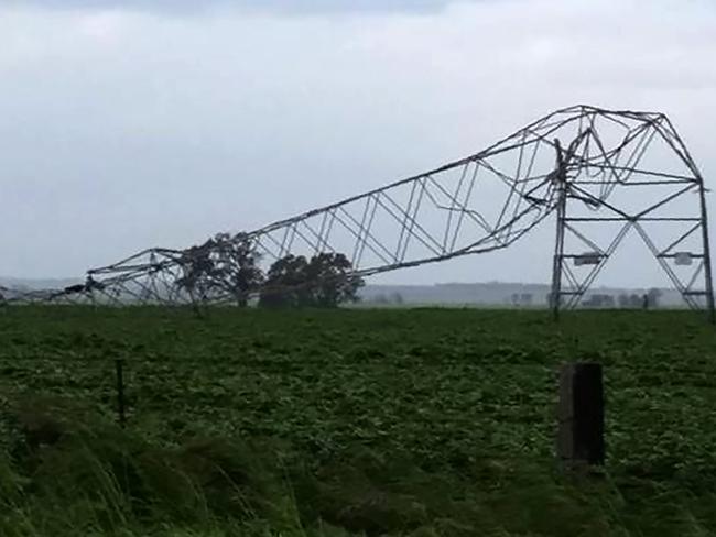 Transmission towers carrying power lines, toppled by high winds near Melrose in South Australia. Picture: Debbie Prosser/AFP