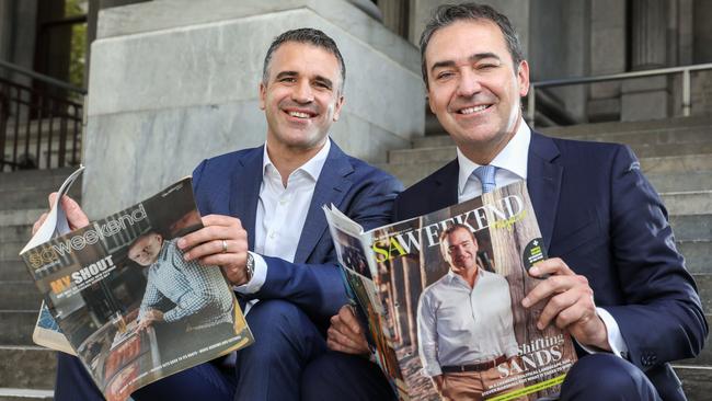 Steven Marshall and Peter Malinauskas with older editions of SA Weekend. Picture: Russell Millard