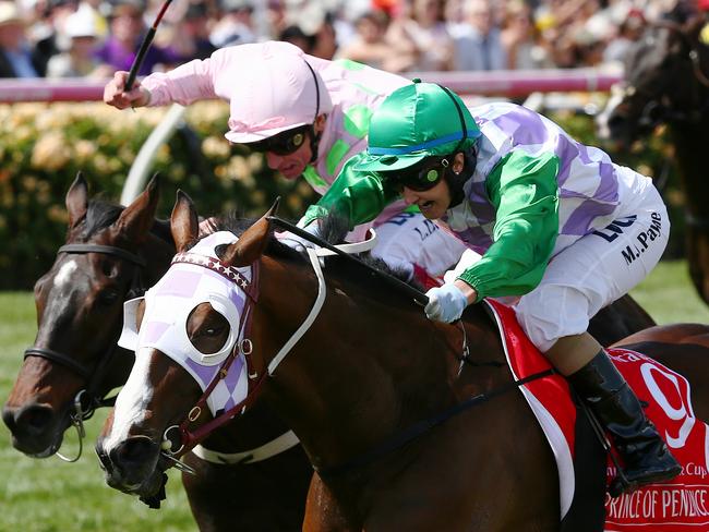 Michelle Payne crosses the line to become the first female jockey to win the Melbourne Cup. Picture: George Salpigtidis