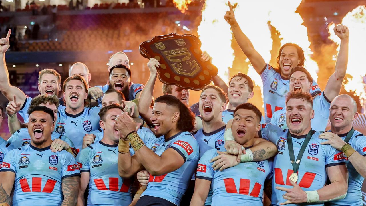 The NSW Blues celebrate after winning game 3 of the State of Origin at Suncorp Stadium. Picture by Luke Marsden.