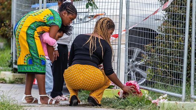 Neighbours leave flowers at the house. Picture: Sarah Matray