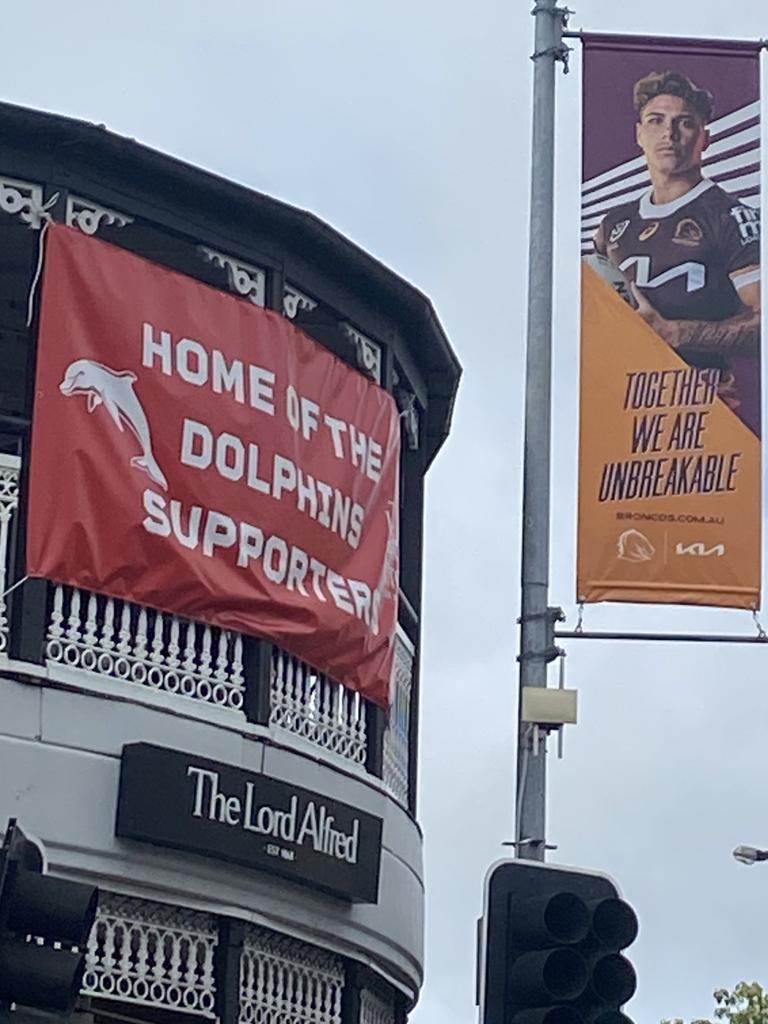 The Dolphins' sign next to Broncos advertising at the Lord Alfred Hotel on Caxton Street.