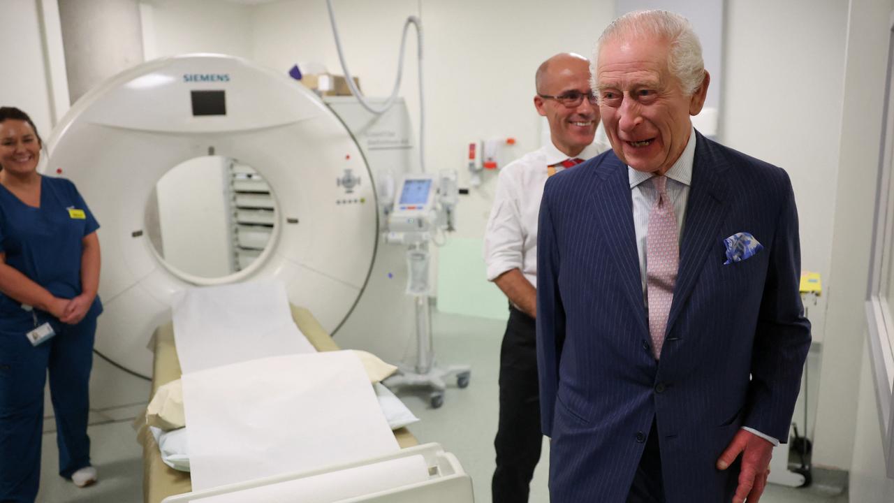 King Charles and Cancer Research UK's Chief Clinician, Charlie Swanton, react next to a CT scanner. Picture: Getty Images