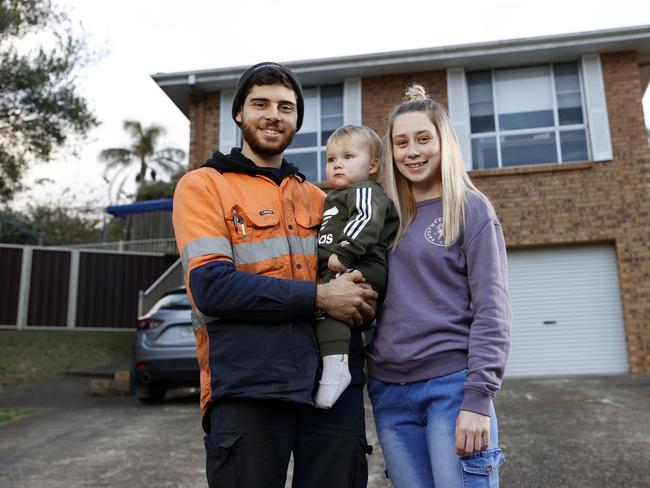 Holly Mulley, 24, and partner Alex McDonald, 25, who can't afford to buy a home in Sydney. Pictured with their 14-month-old son Hunter McDonald at their rental home in Ambarvale. Picture: Jonathan Ng