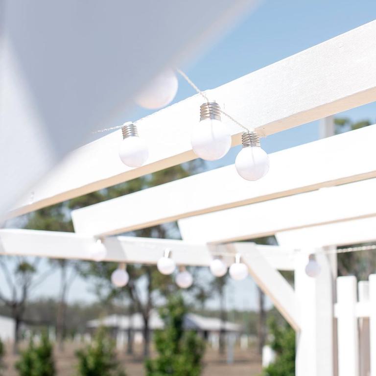 They adorned the pergola with solar party lights.