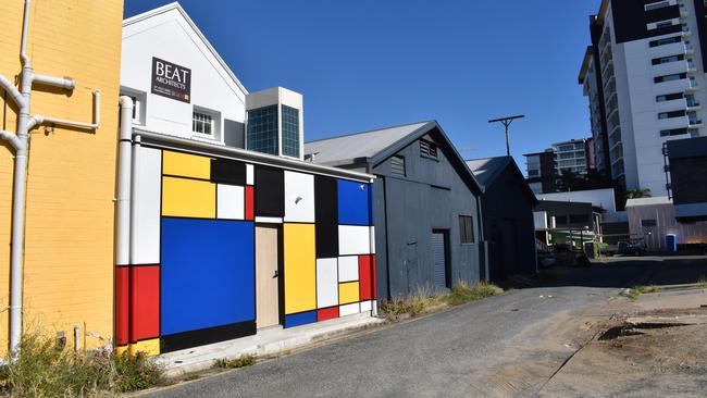 A bright mural at the back of the building on East Lane.