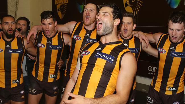 Hawthorn’s David Mirra enjoys the song after his AFL debut. Picture: Michael Klein