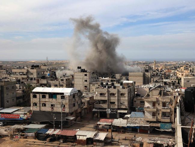 Smoke rises above houses during Israeli bombing on Rafah in the southern Gaza Strip. Picture: AFP