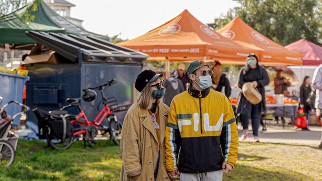 Melbourne Farmers Markets have continued through the pandemic as essential food retailers, with stallholders and shoppers adhering to strict social distancing guidelines and wearing masks. Picture: Melbourne Farmers Markets