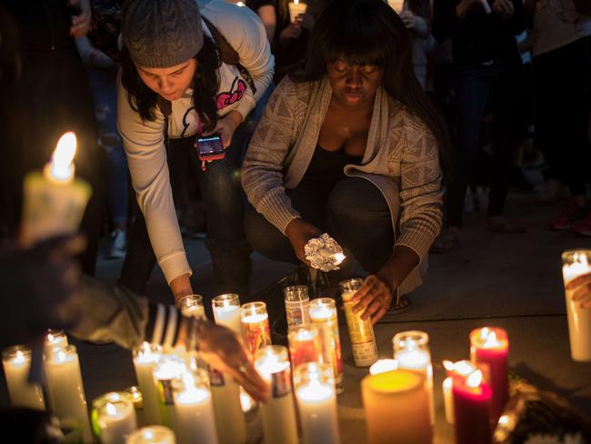 Mourners light candles during a vigil for the victims of Sunday night's mass shooting in Las Vegas. The massacre is one of the deadliest mass shooting events in U.S. history. Drew Angerer/Getty Images/AFP