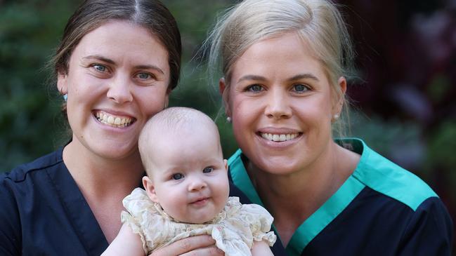 Mater midwife Penny Musumeci, right, with Stanthorpe midwife Melissa Botha and baby Billie Warman. Picture: Mater Hospital