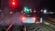 A man has been charged with a range of offences after allegedly driving his car onto the inner-city Newcastle rail corridor, narrowly missing a passenger train, during a pursuit on February 9, 2023. Picture: Supplied.