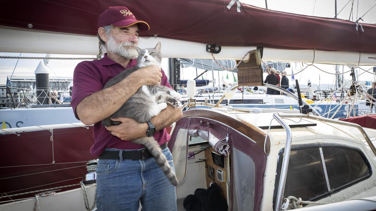 Sylph VI, Robert Williams, with shipmate, Oli the cat. Sylph is the final yacht to complete the Sydney to Hobart 2023. Picture: Chris Kidd