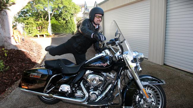 Lev Mizikovsky leaves for work on his Harley Davidson Road King.