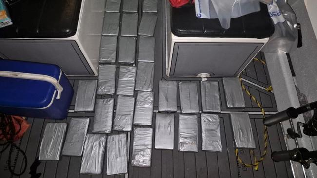 Three Lake Macquarie men have been dramatically arrested as they powered back into a Boyne Island boat ramp, about 24km south of Gladstone on April 28, 2024. Federal Police allege there was 500kg of cocaine on board their 8m tinny. Picture: Australian Federal Police