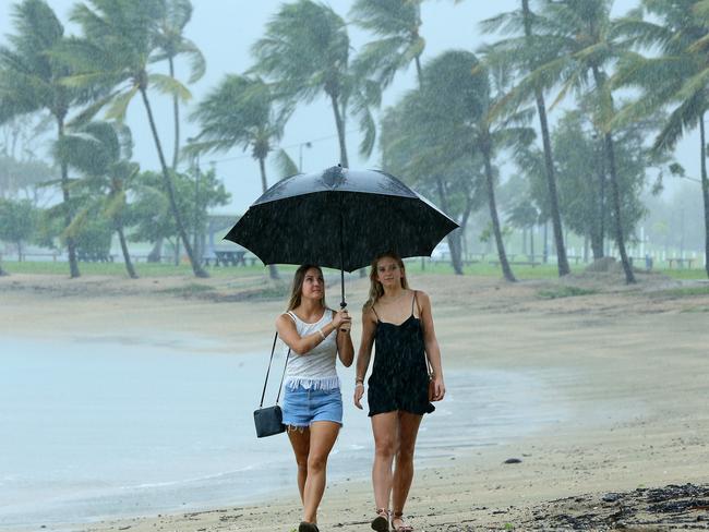 Hamilton Island house keepers Tessa Duscher, 24, and Felicity Guy, 23 of Benalla in Victoria, watch from Airlie Beach as cyclone Debbie approaches. Picture: Liam Kidston.