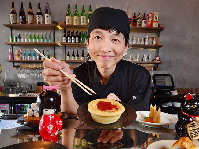 Aussie Four N Twenty Pies will now be sold in Japan.Owner Won min Lee of Ganbare Kaz Kaiten Sushi restaurant in Chapel Street Windsor, with a Four n Twenty pie.Picture : Nicki Connolly