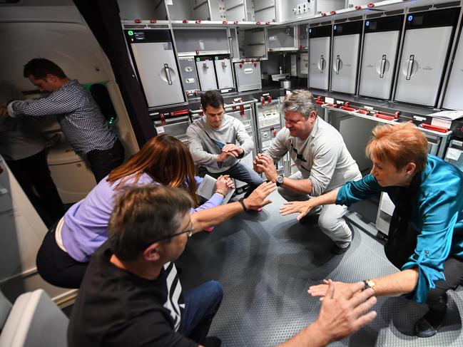 Passengers exercise on board QF7879 from New York to Sydney. Picture: James D. Morgan/Getty Images for Qantas