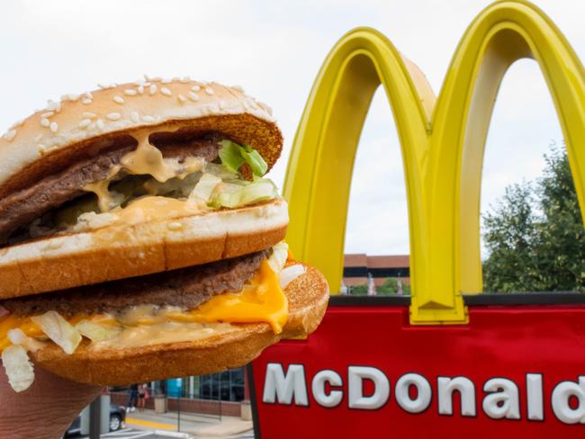 (FILES) This file photo taken on August 10, 2015 shows a McDonald's Big Mac, held up near the golden arches at a McDonalds's in Centreville, Virginia.      McDonald's reported higher second-quarter profits July 25, 2017 behind strong comparable sales in key markets, including the United States, where the chain has launched new products and focused on customer service.  Net income for the quarter ending June 30 was $1.4 billion, up 28 percent from the year-ago period in results that easily topped analyst expectations. Shares rose sharply in pre-market trading. / AFP PHOTO / Paul J. RICHARDS