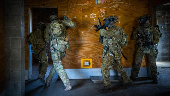 Australian army soldiers from the 3rd Battalion, Royal Australian Regiment, conduct a building clearance during an urban assault conducted as part of the 2022 Duke of Gloucester Cup in Singleton. *** Local Caption *** Australian Army infantry soldiers from across Australia tested their core skills for the prestigious Duke of Gloucester Cup at the School of Infantry, near Singleton in NSW, July 31 - August 5 2022. The Duke of Gloucester Cup is the Armyâ€™s premier military skills competition, pitting the best Royal Australian Corps of Infantry rifle sections from each unit against one another through a series of challenging activities that test their core infantry skills, including marksmanship, tactics, teamwork and fitness. Along with the Duke of Gloucester Cup, five other trophies are awarded: Sir Arthur MacDonald Trophy for best foundation war-fighting skills; Gurkha Trophy for best live-fire shooting; Royal Ulster Rifles Trophy for best falling plate shooting; OSCMAR Trophy for best battle endurance; and the DSM Roche CSC Memorial Cup for best individual soldier. The Duke of Gloucester Cup was created by Prince Henry, Duke of Gloucester, in 1946, while serving as the Governor-General of Australia.
