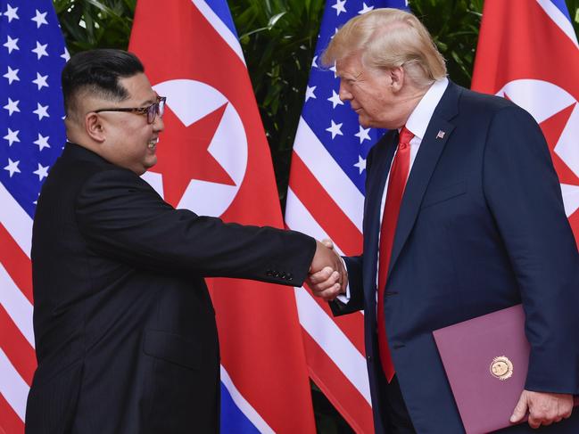 North Korea leader Kim Jong Un and U.S. President Donald Trump shake hands at the conclusion of their meetings at the Capella resort on Sentosa Island Tuesday, June 12, 2018 in Singapore. (AP Photo/Susan Walsh, Pool)