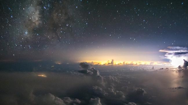 WEB VERSION ** A powerful lightning flashes off the east coast of the US with Miami lights on the backgroundPhoto © 2018 Santiago Borja. All rights reserved. www.santiagoborja.com