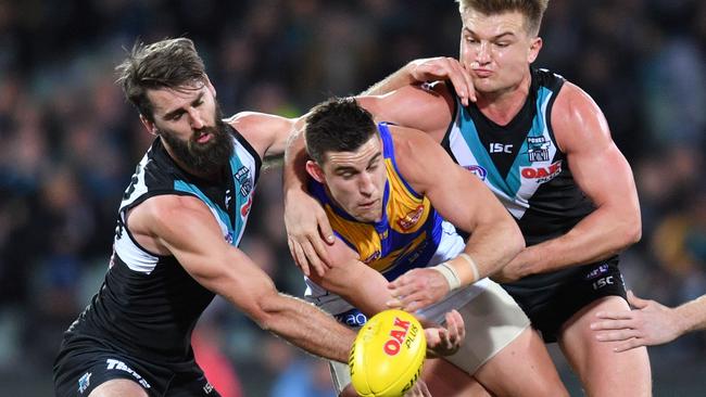 Justin Westhoff and Ollie Wines putting the clamps on Elliot Yeo as the Power failed to hold on against the Eagles last week. Picture: AAP