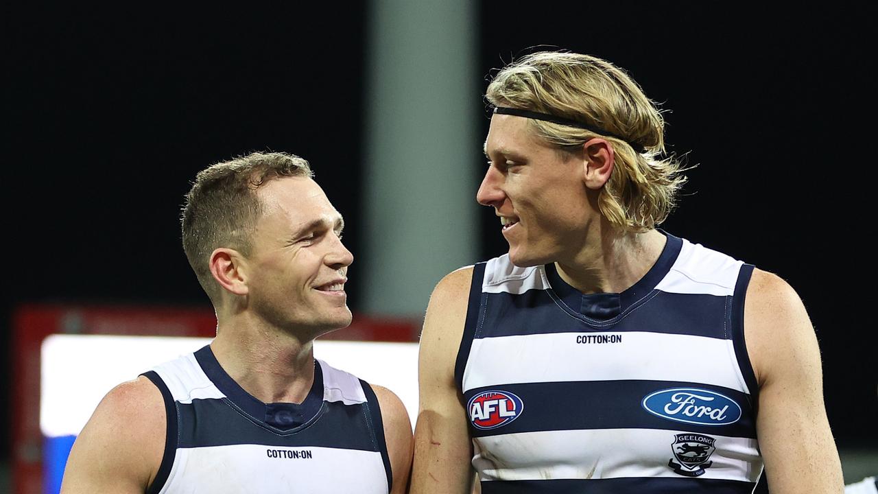 Pleased skipper Joel Selwood walks of with Mark Blicavs. Picture: Getty Images