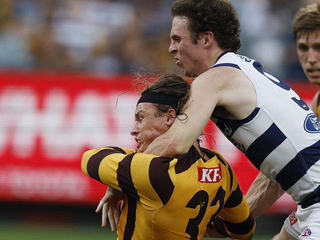 Play on: Jack Ginnivan of the Hawks gets taken high by Max Holmes but no free kick was given during the third quarter. Picture: Michael Klein