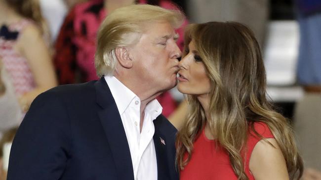 US President Donald Trump kisses his wife, first lady Melania Trump, after a campaign rally. Picture: AP