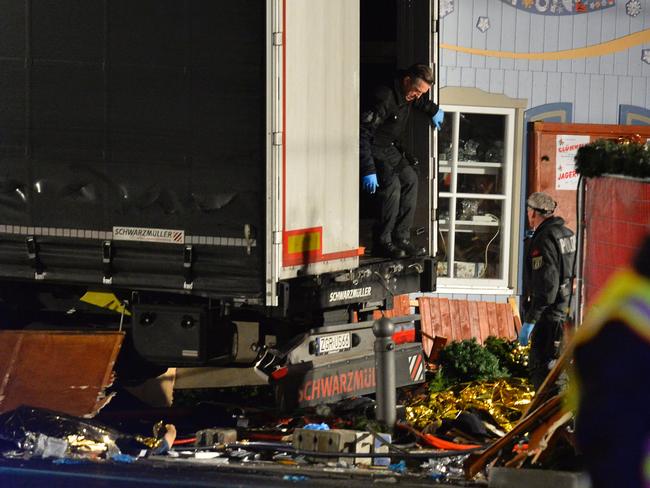 Policemen get of the truck that speeded into a christmas market in Berlin, on December 19, 2016 killing at least one person and injuring at least 50 people. Picture: AFP