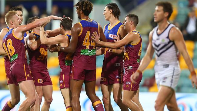 Brisbane players celebrate their win over Fremantle. Picture: Getty Images