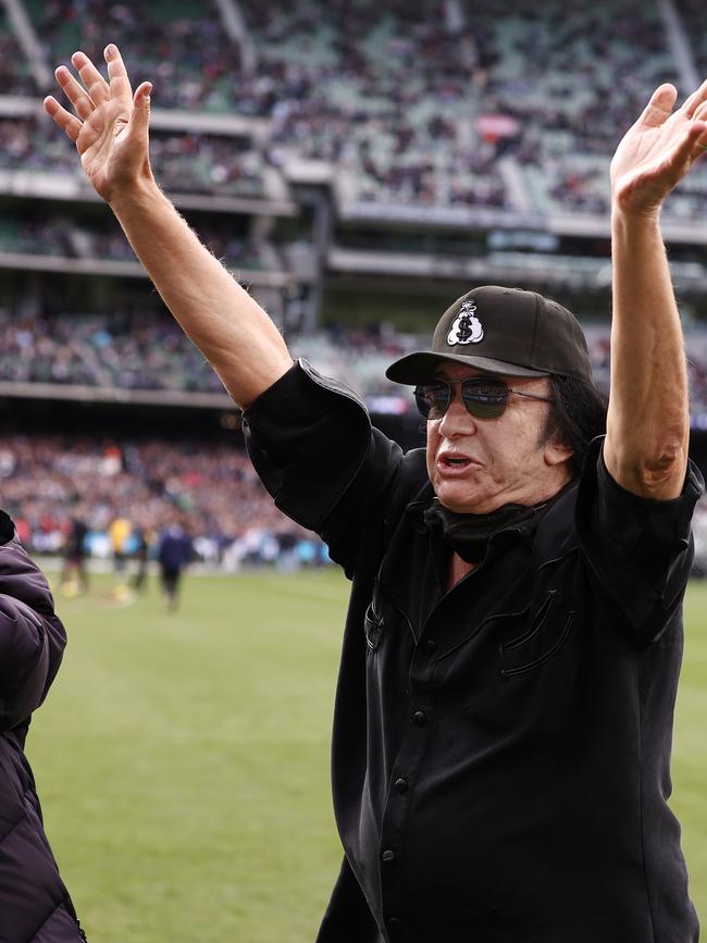 Carlton Blues fan Gene Simmons presents the match-day ball for the clash against the Collingwood Magpies at the MCG. Picture: Michael Klein