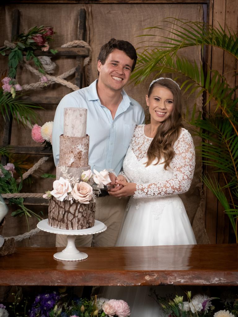 Chandler Powell and Bindi Irwin on their wedding day cutting the cake. Picture: Kate Berry