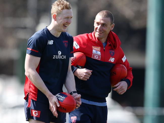 Melbourne training at Gosch's Paddock.  Melbourne's Clayton Oliver and coach Simon Goodwin have a laugh . Pic: Michael Klein