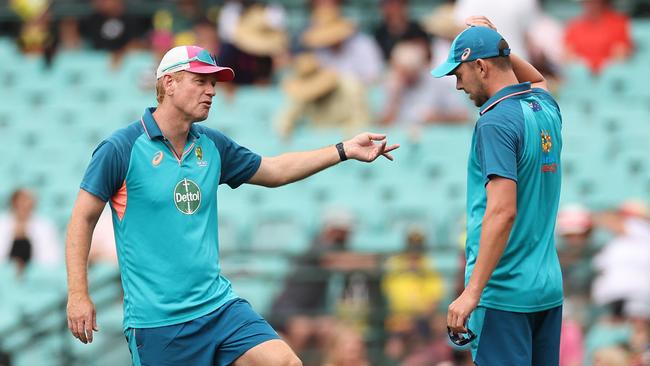 Australian coach Andrew Mcdonald speaks with returning quick Josh Hazlewood. Picture: Getty