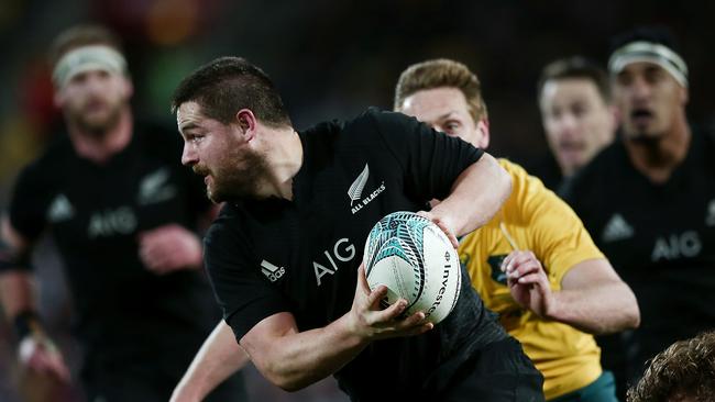 Dane Coles of New Zealand is chased down by Dane Haylett-Petty of Australia.