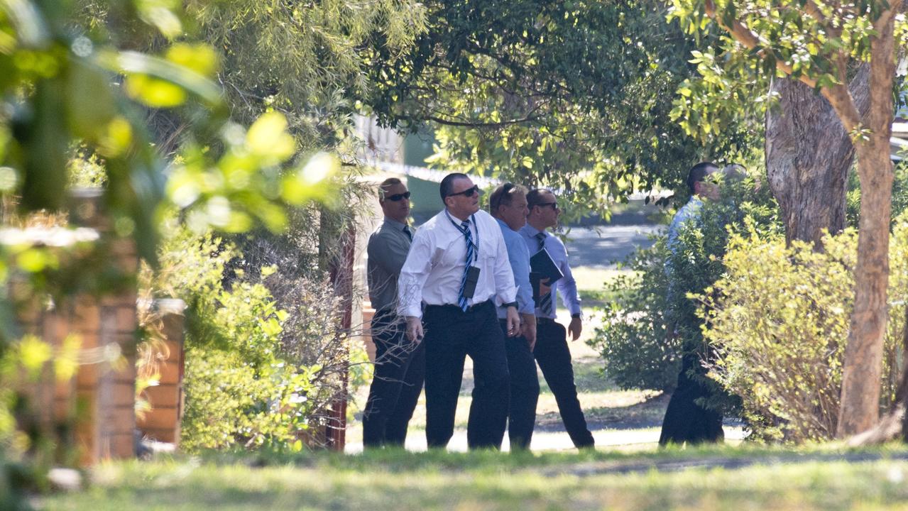 Toowoomba detectives at the crime scene in Rivett St, Centenary Heights. Picture: Kevin Farmer