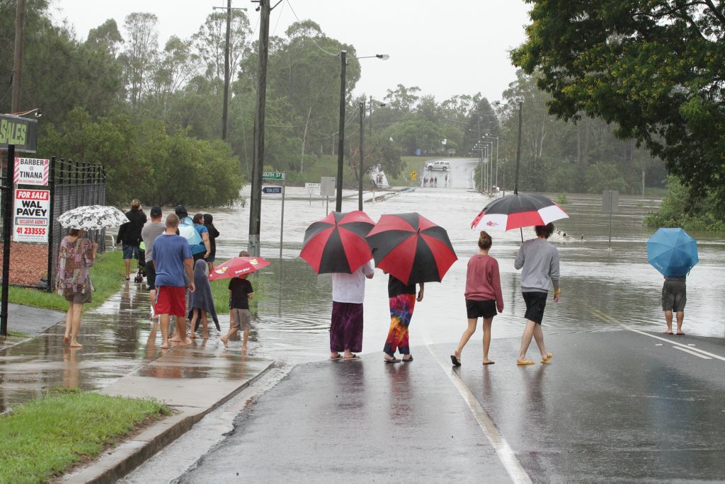 Sightseers watch the Mary River rise at the Lammington Bridge. Photo: Robyne Cuerel / Fraser Coast Chronicle. Picture: Robyne Cuerel