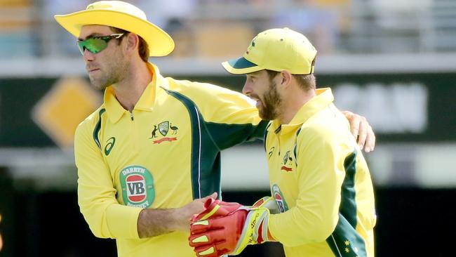 Glenn Maxwell and Matthew Wade in the field fo Australia. Picture: Jono Searle