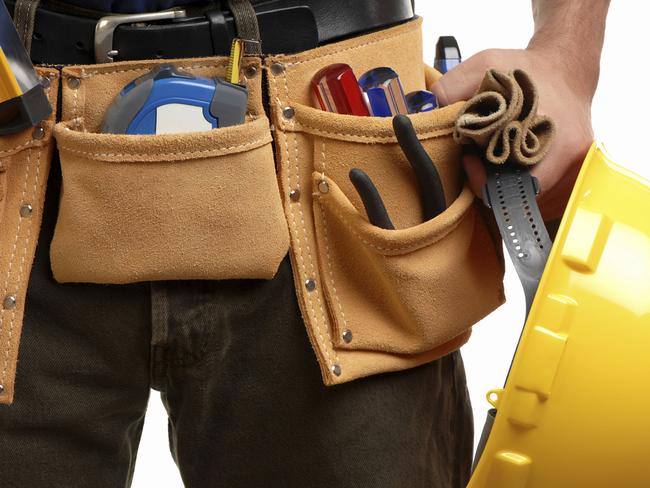 Generic image of tradesman tradie holding tools and hardhat, wearing tool belt. ONE USE ONLY.