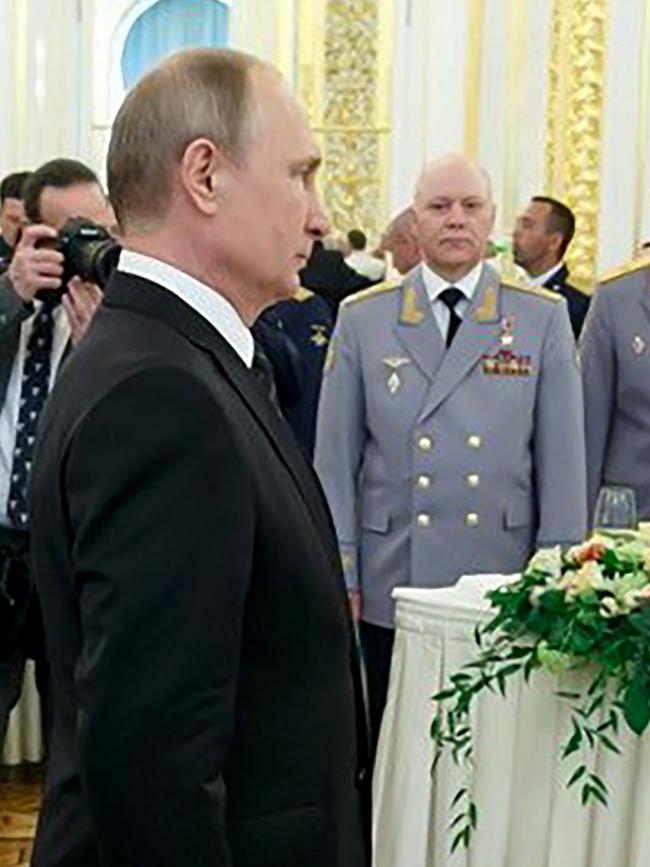 Russian President Vladimir Putin and Igor Korobov attending a reception at the Kremlin in Moscow.