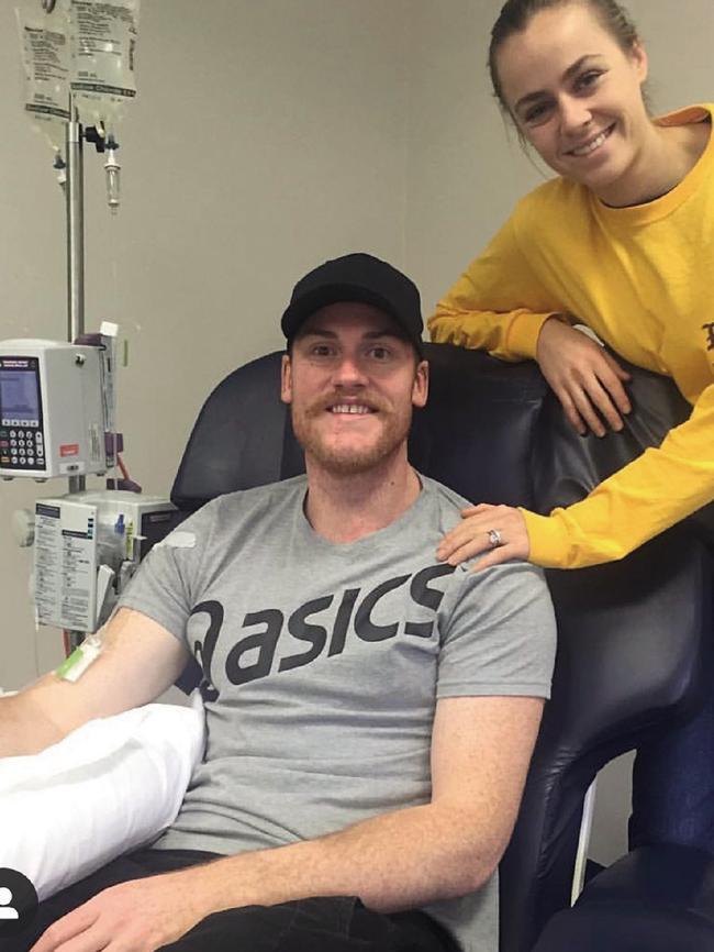 Jarryd Roughead during treatment with wife Sarah.