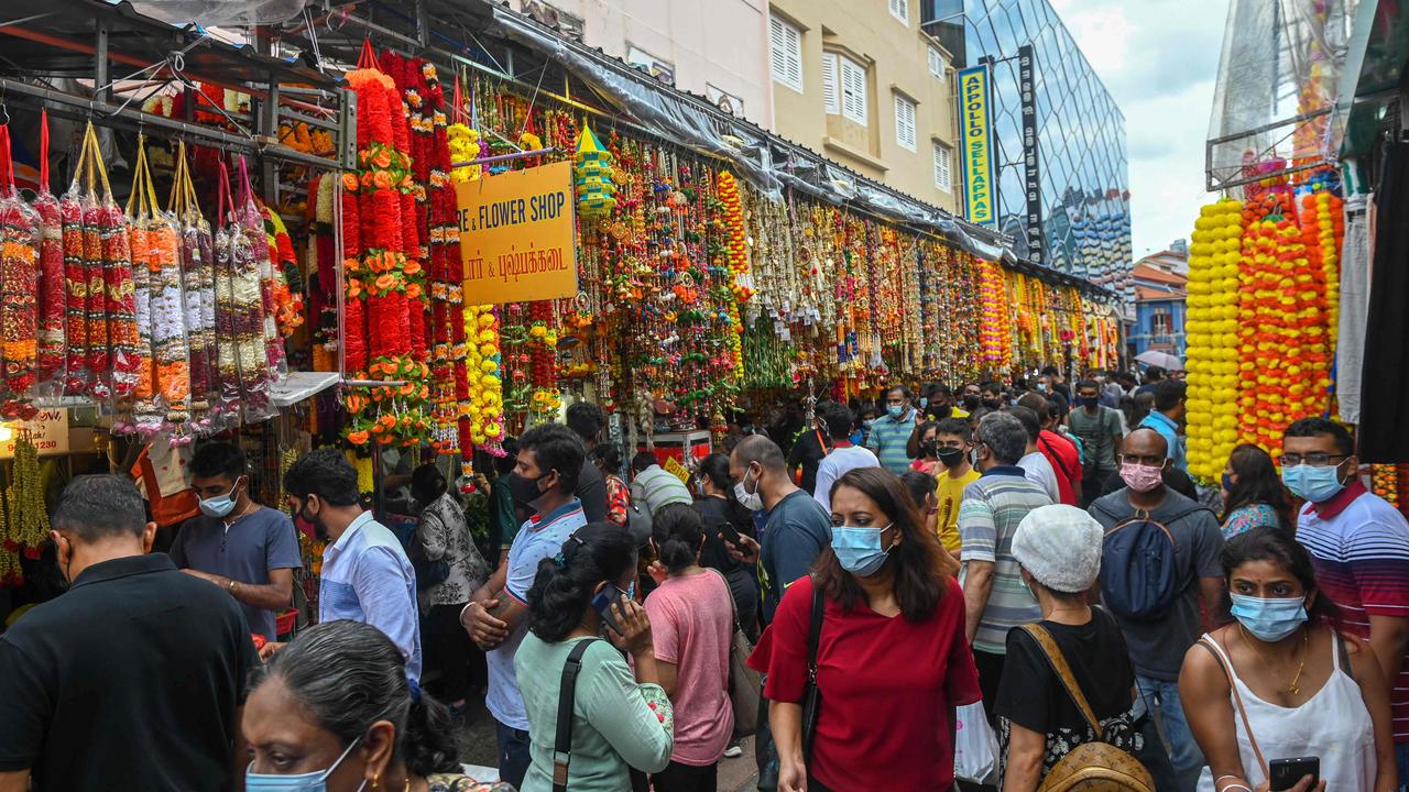 Crowds in the Little India district in Singapore earlier this month. (Photo by Roslan RAHMAN / AFP)